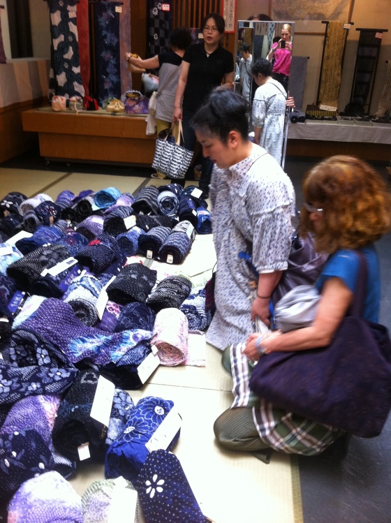 My sensei (right) and her colleague admiring rolls of Shibori fabrics.